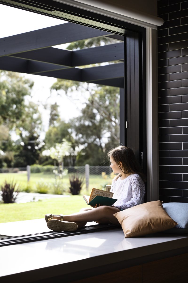 flinders house girl sitting window